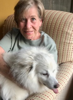 Photo: Portrait of Member Julie with her dog